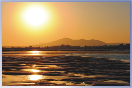 Sonnenuntergang &uuml;ber der Ria Formosa bei Ebbe